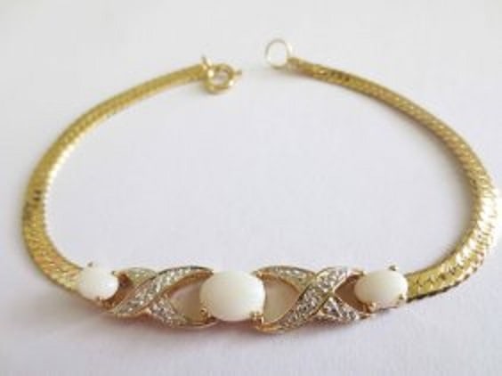 1.17 Cts Opal & Diamond 18KGP Designer Bracelet: 1 piece of GENUINE 8x6mm oval white Indian opals quality AAA no treatment.2 pieces of GENUINE 6x4mm oval white Indian opals quality AAA no treatment.2 pieces of GENUINE single cut diamonds, 0.01 carat
