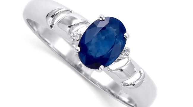 1.07 Cts Certified Diamonds & Blue Sapphire 14K Gold Designer Ring: Gemstone DescriptionGemstone: SapphireColor: BlueShape: OvalSize: 7x5Quantity: 1CTW: 1.05 Diamond DescriptionShape: RoundsSize: 1.00 mm Quantity: 2CTW: 0.02Grade: I2-13Color: H-I Material