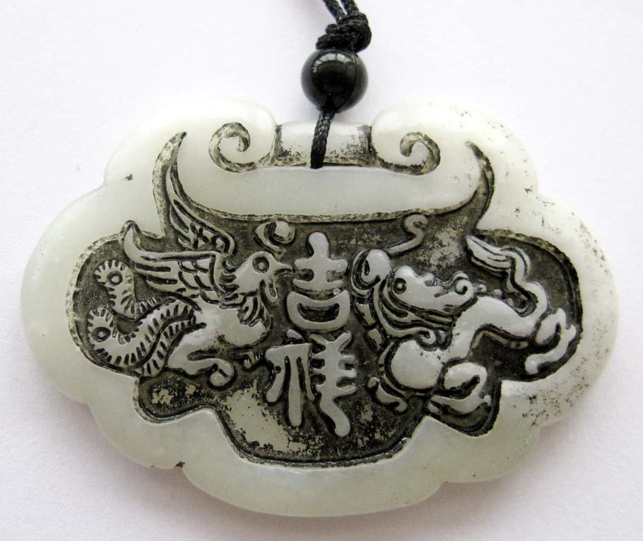 Zhou Dynasty Jade Dragon Phoenix Love Pair Amulet: Approx Size: 2" Diameter. It is the customary and traditional belief of Chinese people that wearing the jade is the good means of which people will be protected from bad luck, evil spirit and danger. 