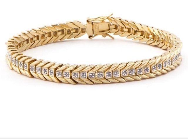 0.23 CT Diamond 18KGP Designer Bracelet: 30 Single cut round diamonds Color: I-J & Clarity: I2-I3 No treatment.18.55 grams of brass layered with 18k yellow gold.Length is 7 1/2 inches.The width is 1/4 inches.
