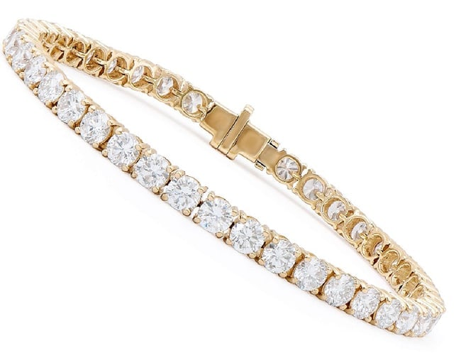 $18,995 Value! 5.35 Cts IGI Certified Top Lab Grown Diamond Bracelet E VVS IDEAL Cut: Lab Grown Diamonds Description: Shape: Rounds, Size: 3.10mm Quantity: 52Grade: VVSColor: E Material Information: Primary Material: 14K Solid Gold (Marked)Color: Yellow Gold Jewelry Information: Mount