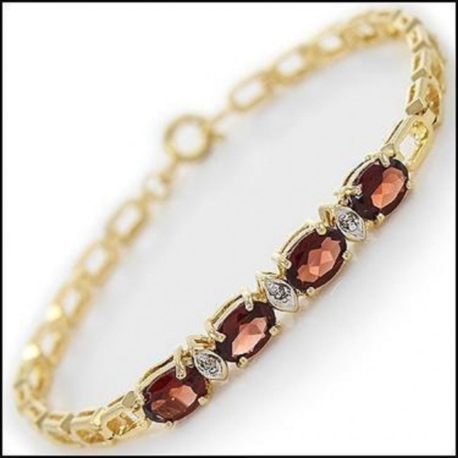 3.52 Cts Garnet & Diamond 18KGP Designer Bracelet: 4 pieces of GENUINE 7x5mm Oval Garnets.3 pieces of GENUINE single cut diamonds, 0.02 carat Tw. 5.55 grams of base metal layered with 18K yellow gold.The length is 7 1/2 inches. The width is 1/4 inches