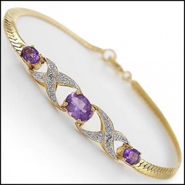 1.72 Cts Amethyst & Diamond 18KGP Designer Bracelet: 3 pieces of GENUINE 3.5-7.5 mm oval Amethysts quality AAA no treatment.2 pieces of GENUINE single cut diamonds, 0.02 carat Tw. 6.89 grams of base metal layered with 18K yellow gold.The length is aroun