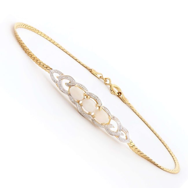 $2,175 Value! 1.76 cts Natural Diamond Opal 18KGP Sterling Silver Designer Bracelet #2059: Diamond Description Shape: Round ,Size: 1.2mm, Quantity: 2, CT: 0.06, Grade: I2, Color: H-I, White Opal : 3, 6x4mm, 1.70 ct, Material Information:Plating Material: 18K Yellow Gold, Primary Material:St