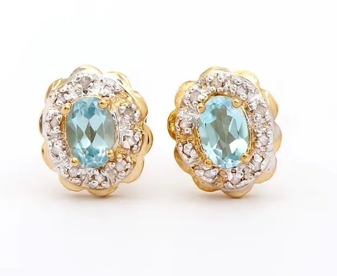 1.30 Cts Natural Blue Topaz Diamonds 18K Gold Plated Designer Earrings $1,275!: Gemstone DescriptionGemstone: Blue TopazColor: Sky BlueShape: OvalSize: 6x4Quantity: 2CTW: 1.12 Diamond DescriptionShape: RoundsSize: 1.1mm Quantity: 20CTW: 0.18Grade: I3Color: H-I Material Informatio