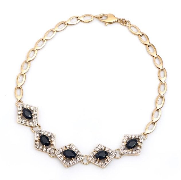 2.20 Cts Sapphire & Diamond 18KGP Designer Bracelet: 3 pieces of GENUINE 6x4mm ovals Sapphires quality AAA no treatment.20 pieces of GENUINE single cut diamonds, 0.15 carat Tw. 5.75 grams of base metal layered with 18K yellow gold.The length is around 7