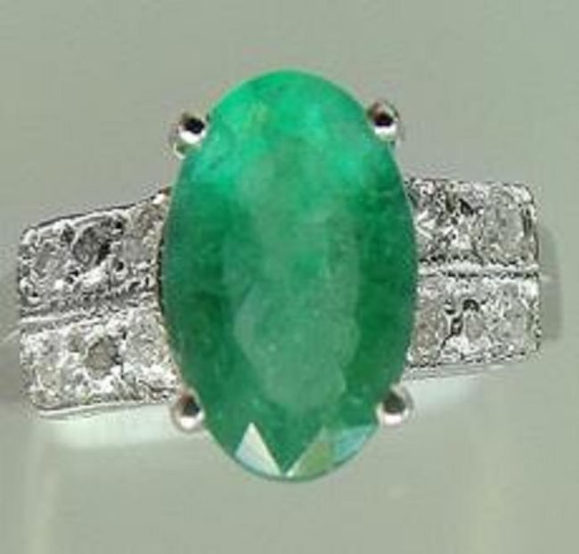 $5,495 Value! 1.75 Ct GLS Certified Natural Diamond Emerald 14K Ring: Gemstone Description:Gemstone: EmeraldColor: GreenShape: OvalSize: 9x7Quantity: 1CT: 1.55 Diamond Description:Shape: RoundSize: 1.2mm Quantity: 24CT: 0.2Grade: I1-I2Color: H-I Material Information:Pri