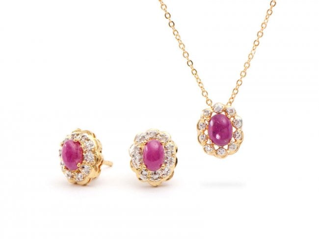 2.82 Cts Cabochon Ruby & Diamond Designer Set $1,220: One Plated 18KT Yellow Gold 2.80ctw Ruby and Diamond Pendant with Chain and Earrings. (1) Ruby with a total weight of 1.50cts. (2) Rubies with a total weight of 1.30cts. (32) Diamonds with a total wei