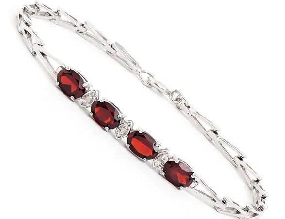 3.35 Cts Natural Garnet Diamonds Rhodium Plated Designer Bracelet $1,285!: Gemstone DescriptionGemstone: GarnetColor: BrownShape: OvalSize: 7x5Quantity: 4CTW: 3.32 Diamond DescriptionShape: RoundsSize: 1.1mm Quantity: 3CTW: 0.03Grade: I3Color: H-I Material Information:Platin