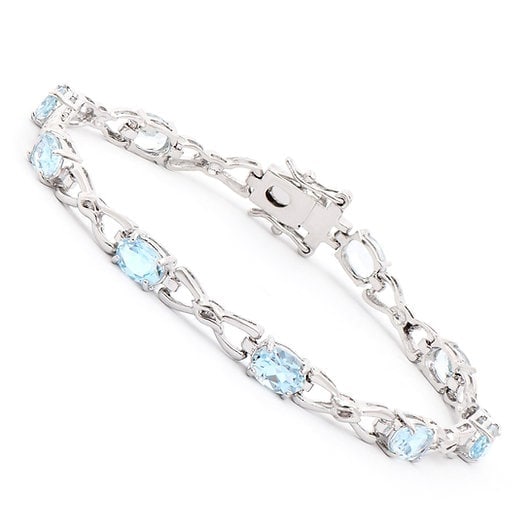 8.55 ctw Blue Topaz Rhodium Plated Designer Bracelet $1,675!: Gemstone DescriptionGemstone: Blue TopazColor: Sky BlueShape: OvalSize: 7x5Quantity: 9CTW: 8.55 Material Information:Plating Material: RhodiumPrimary Material: Base Metal Jewelry Information:Mount Typ
