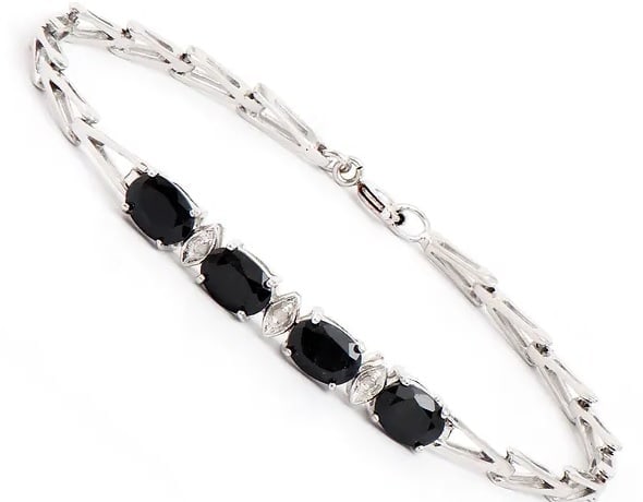 4.05 Cts Natural Sapphire Diamonds Rhodium Plated Designer Bracelet $1,385!: Gemstone DescriptionGemstone: Black SapphireColor: BlackShape: OvalSize: 7x5Quantity: 4CTW: 4.02 Diamond DescriptionShape: RoundsSize: 1.1mm Quantity: 3CTW: 0.03Grade: I3Color: H-I Material Informatio