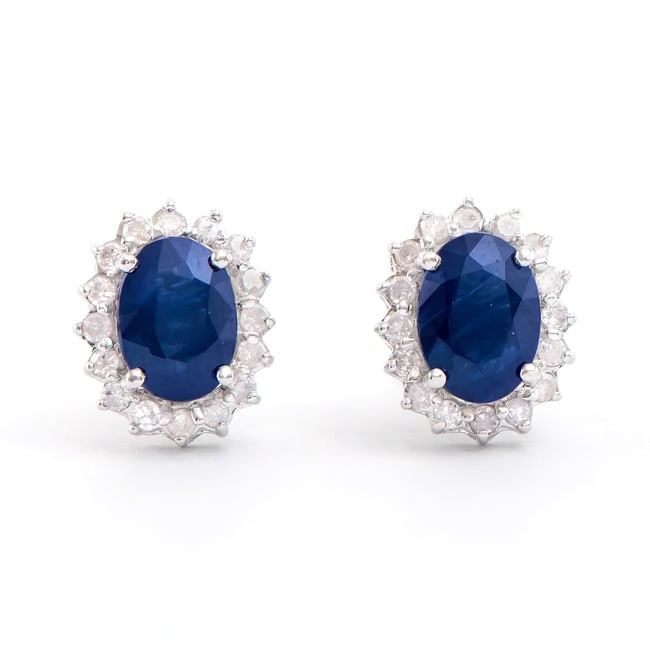 $4,895 GLS Appraisal Value! ! 2.31 Cts Certified Natural Sapphire Diamond 14K Designer Gold Earrings: Gemstone: Blue SapphireColor: BlueShape: OvalSize: 7x5Quantity: 2CTW: 2.05 Diamond DescriptionShape: RoundsSize: 1.2mm Quantity: 32CTW: 0.26Grade: I2-I3Color: H-I Material Information:Primary Material