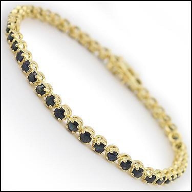 6.45 CT Black Sapphire 18KGP Designer Bracelet $1,285: 46 pieces of GENUINE 4mm faceted Sapphires quality AAA.7.62 grams of brass layered with 18K yellow gold.The length is around 7 1/2 inches.The width is 3/16 inches or .4mm.This lovely bracelet comes in