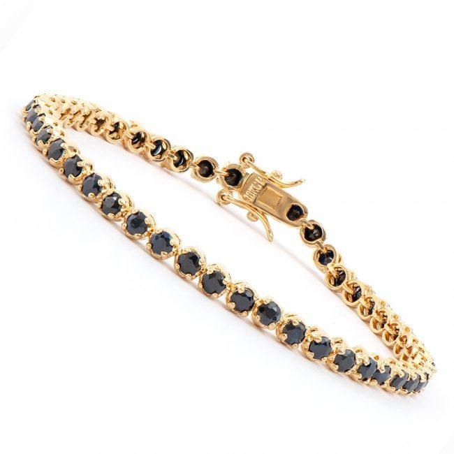 6.45 CT Black Sapphire 18KGP Designer Bracelet $990!: 46 pieces of GENUINE 4mm faceted Sapphires quality AAA. 7.62 grams of brass layered with 18K yellow gold. The length is around 7 1/2 inches. The width is 3/16 inches or .4mm. This lovely bracelet come