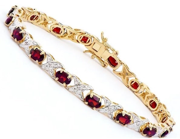 7.34 Ct Natural Garnet Diamond 18KGP Designer Bracelet $1,695!: Gemstone DescriptionGemstone: GarnetColor: BrownShape: OvalSize: 6x4Quantity: 16CTW: 7.2 Diamond DescriptionShape: RoundsSize: 1.1mm Quantity: 16CT: 0.14Grade: I2Color: H-I Material Information:Platin