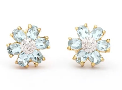 2.02 Cts Natural Blue Topaz Diamonds 18KGP Designer Earrings $1,365!: Gemstone DescriptionGemstone: Blue TopazColor: Sky BlueShape: OvalSize: 4x3Quantity: 12CTW: 2 Diamond DescriptionShape: RoundsSize: 1.2mm Quantity: 2CTW: 0.02Grade: I2Color: H-I Material Information:P