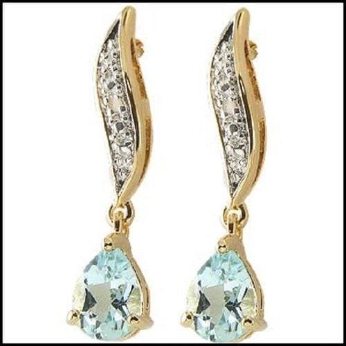 1.84 Cts Blue Topaz & Diamond 18KGP Designer Earrings: 2 pieces of GENUINE 2X3 mm Pear shape Blue Topaz quality AAA no treatment.2 pieces of GENUINE single cut diamond 0.04 carat Tw.5.19 gram of base metal layered with 18K yellow Gold.