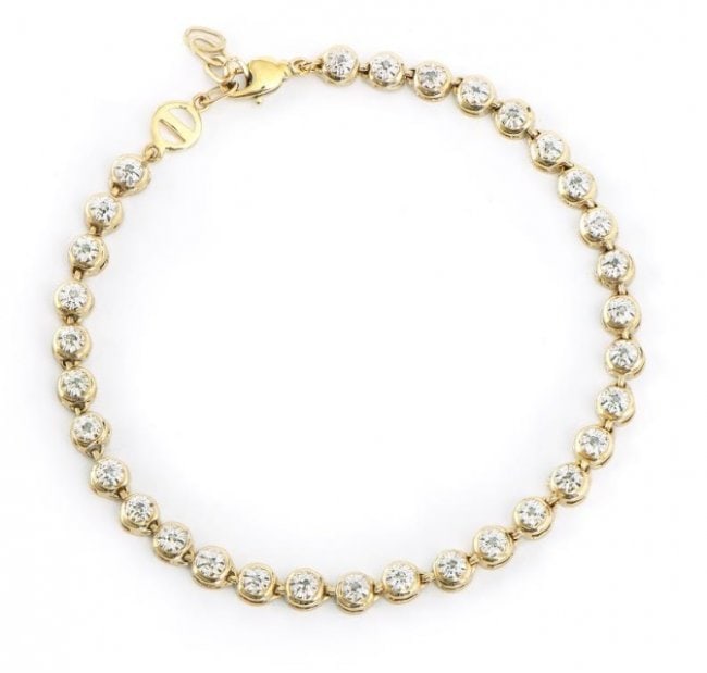 0.25 Cts Diamond 18KGP Designer Bracelet: 32 Single cut 1.1 mm round diamonds Color: I-J & Clarity: I2-I3 No treatment.7.86 grams of base metal layered with 18k yellow gold.Length is 7 1/2 inches.The width is 1/4 inches.