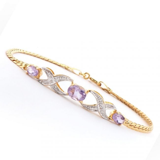 1.80 ctw Amethyst & Diamond Designer Bracelet $895: One Plated 18KT Yellow Gold 1.80ctw Amethyst and Diamond Bracelet. (3) Amethyst stones with a total weight of 1.80cts. (2) diamonds measuring 1.1mm. 4.85 grams of brass layered with 18K yellow gold. T
