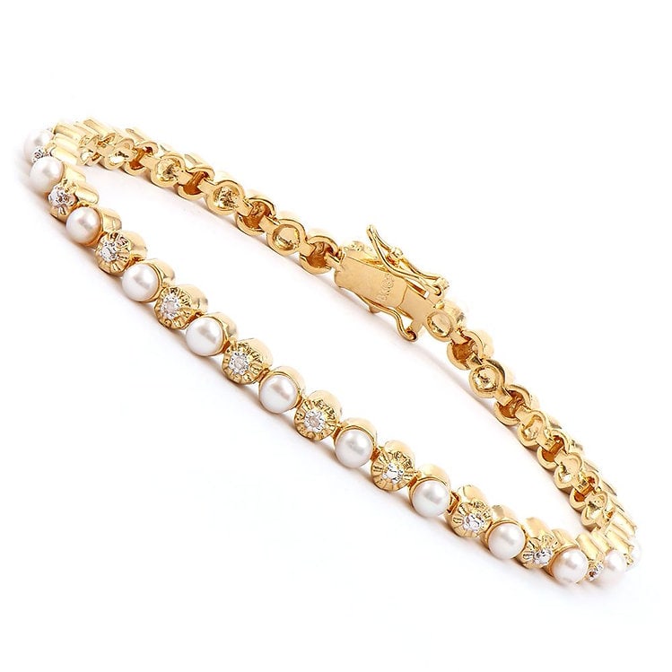 8.07 CT Freshwater Pearl & Diamond Designer Bracelet: 23 pieces of 2.4-2.7mm freshwater pearls no treatment quality AAA.3 pieces of single cut diamonds, no treatment quality I2-I3 .10.62 grams of base metal layered with 18K yellow gold.The length is 7