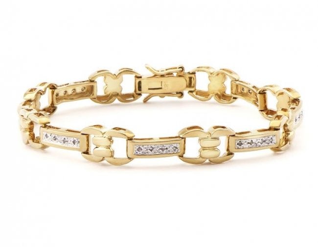 0.78 CT Diamond Designer Bracelet MSRP $1,585.00!: 21 Single cut 0.9mm round diamonds Color: I & Clarity: SI2 No treatment. 11.5 grams of Base Metal layered with 18k yellow gold. Length is 7 1/2 inches. The width is 1/4 inches.
