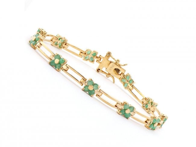 3.05 Cts Emerald Designer Bracelet $1,215: One Plated 18KT Yellow Gold 3.00ctw Emerald Bracelet. (44) Emerald stones with a total weight of 3.00cts. Total weight of 8.05 grams of brass layered with 18K yellow gold. The length of this bracelet 