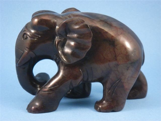 Solid Blood Jade Crafted Elephant: Item Description: up for auction is a solid blood jade crafted strong walking elephant, item width is approximately 5-5/8"and height is approximately 3-1/2" *Wooden display stand is extra $5 but optio