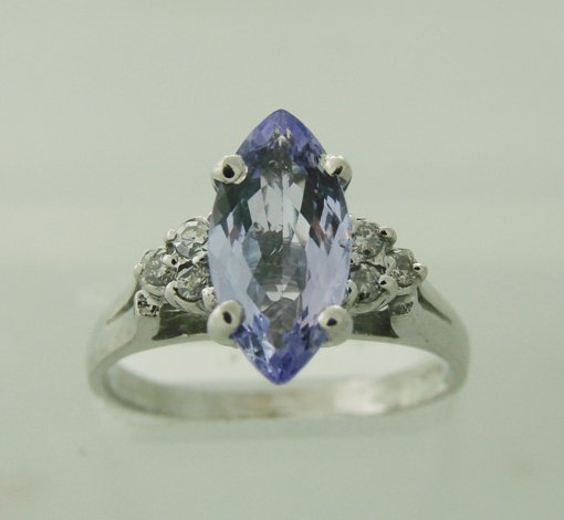Diamond & Tanzanite Ring Appraised $6,150: Gem Type: Diamond / Tanzanite Ring Quality: 6 Pieces Round Brilliant Diamond weight: .18 carat Clarity SI1 Color G Tanzanite 3.15 carat genuine Marquise shape Composition: Natural Clarity Transparent 