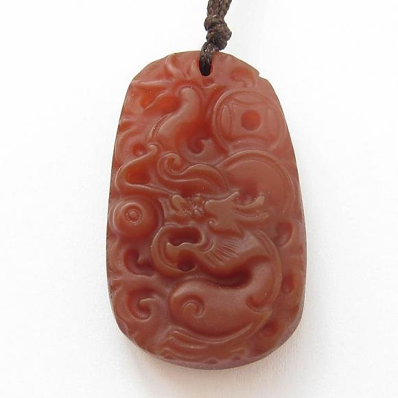 115 Cts Red Carnelian Chinese Zodiac Dragon Pendant: This Chinese dragon pendant is made of red carnelian. Mythical dragon are the most auspicious symbol in Chinese culture. Dragon is also the fifth sign of 12 Chinese Zodiacs. This is lucky amulet for p