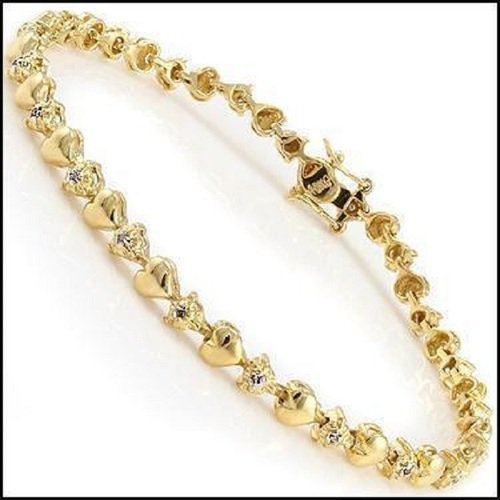 0.61 CT Diamond Designer Hearts Bracelet: 11 Single cut 1mm round diamonds Color: I & Clarity: SI2 No treatment. 9.35 grams of silver/brass layered with 18K yellow Gold. Length is 7 1/2 inches. The width is 1/4 inches.