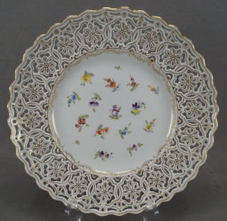 RK Dresden Reticulated Porcelain Plate: Nice reticulated porcelain plate. Decorated with small hand painted scattered flowers in pink, purple, orange, and yellow flowers. With gold highlights to the reticulation. Impressed Meissen on the ba