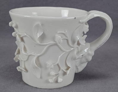 18th Century Chantilly White Floral Encrusted Mug: Nice antique 18th century French Chantilly white porcelain mug with applied floral encrustation and ram's head handle. Marked on the bottom with the hand painted blue underglaze mark used by