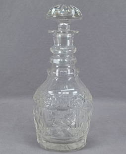 Anglo Irish Cut Glass Decanter Circa 1920-1930s: Nice vintage hand blown clear Anglo Irish decanter with three neck rings. With cut panels above a band of cut diamonds, above cut Xs in squares with cut lines in between and additional panel cutting b