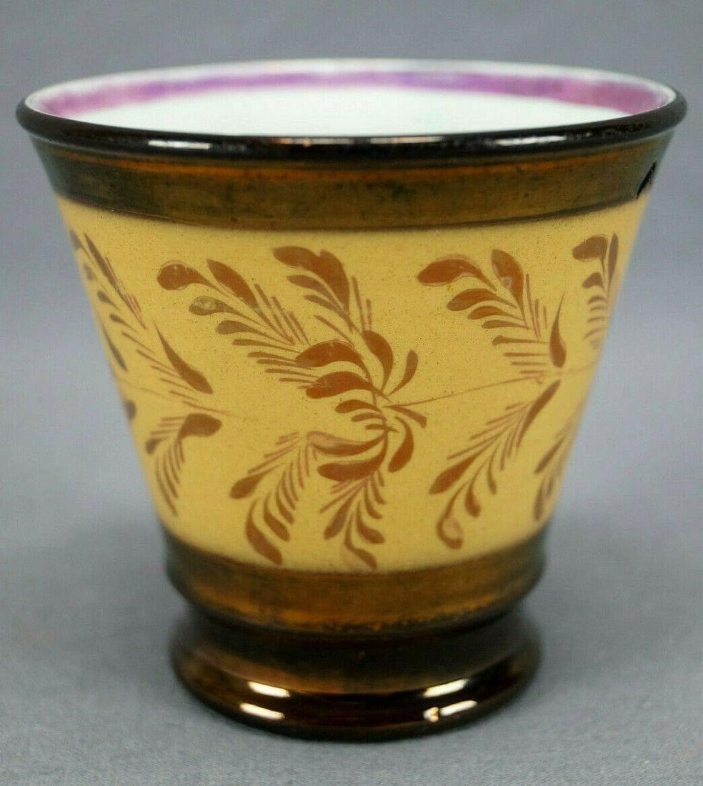19th Cent British Copper Luster Small Beaker: Nice 19th century British antique copper luster beaker. Decorated with an orange ocher band with pink luster leaves and flowers. Unmarked.Has wear consistent with age and use, and two flakes to the fo