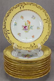 Set of 10 RL Dresden Hand Painted Soup Bowls: Set of 10 antique Austrian porcelain soup or salad bowls. Decorated with hand painted flowers in purple, red, orange, blue, and yellow. These have a yellow border with gold scrollwork. Gold gilding