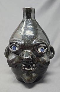 Grace Nell Hewell 8" Face Jug Folk Art Pottery: American folk art face jug by Grace Nell Hewell. She lived in Gillsville, Georgia, from a multi generational of Hewell's who have passed down the craft. She lived from 1933 to 2016. Made from red