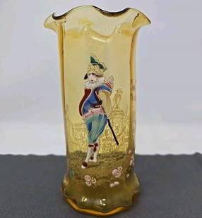 Theodore Rossler Hand Enameled Punchinello Glass Vase: Bohemian Theodore Rossler hand enameled spill vase in amber. It features a Punchinello, a short, stout comical person, against a painted gold backdrop. It has a ruffled rim and is optic molded. 