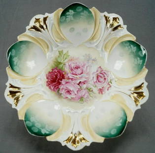 RS Prussia Pink Roses Large Bowl Circa 1880-1910: Relief molded large porcelain bowl. Decorated with dark and light pink roses over a cream background. With cream, blue green and gold highlights along the relief molded sides. White shadow flowers ove
