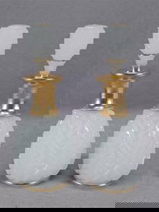 Pair of Antique Bohemian Alabaster Glass Perfumes: Pair of antique mid 19th century Bohemian or Silesian white alabaster glass perfume bottles. Mold blown floral and diamond pattern. Gold gilding around the neck and rim and to the top of the stopper.