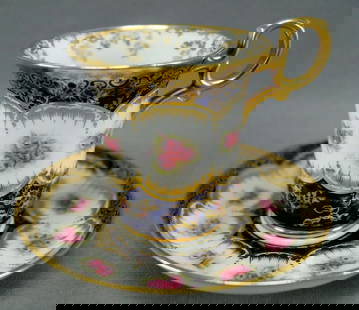 Paragon Pink Roses Cobalt Cup & Saucer Circa 1907: Antique bone china empire form chocolate cup and saucer. Decorated with hand colored pink roses over white framed by gold gilt scrollwork designs. With cobalt along the top and bottom of the saucer,