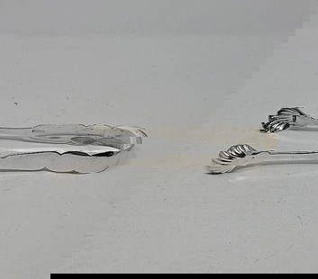 Coin Silver Stoddard Sugar Tongs 1818-1847 NY: Coin silver tongs by Stoddard. Circa 1818 to 1847 from New York, New York. There is a starting of stress crack on one side from use. Classic shell design. Measures approximately 6 3/4 inches long.