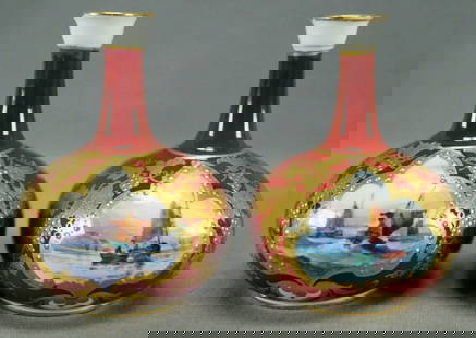2 Royal Crown Derby Signed WD Maritime Mini Vases: Pair of bone china miniature vases. Decorated with hand painted boats on water framed by gold gilt beading and raised and beaded gold floral grape vines. Has an overall red background. Marked on the b