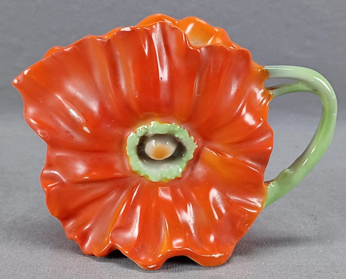 Royal Bayreuth Poppy Flower 3 7/8 Inch Creamer: Antique German Bavarian relief molded Art Nouveau red and green poppy flower creamer. Marked on the base in blue Royal Bayreuth Bavaria. This mark was used starting in 1902.Has some spots of wear to t