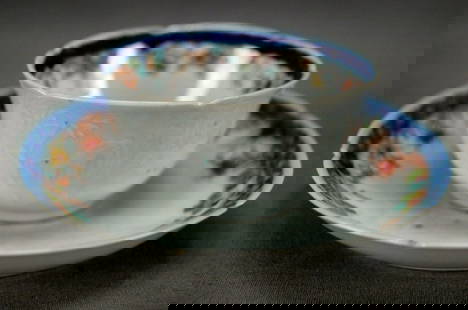 18th Century Chinese Embossed Tea Bowl & Saucer: Rare 18th century Chinese export porcelain tea bowl and saucer. With embossed floral design on the outside of the tea bowl and to the saucer. Has a blue hand painted underglaze flower in the center of
