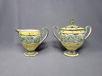 Wedgwood Art Nouveau Creamer & Sugar Lustre: Wedgwood Lustre / luster glaze art nouveau pedestal creamer and covered sugar. This is a yellow luster with green scrolls and gold design and green leaves under the handle on lid. Some crazing of glaz