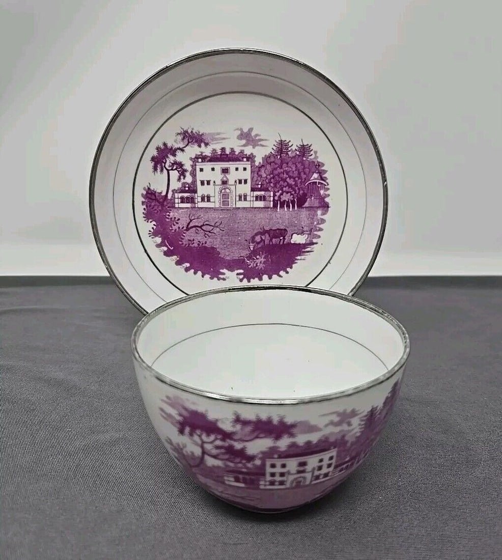 Thomas Wolfe Purple Bat Painted Cup & Saucer #1: Staffordshire purple bat painted cup and saucer set with silver luster rims by Thomas Wolfe, Factory Z. While it is not marked, and I could not find a pattern, the tea cups match known Thomas Wolfe cu