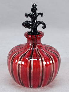 Italian Murano Cenedese Vetri Perfume Bottle: Nice vintage Italian Murano Cenedese Vetri blown glass perfume bottle in a Filigrana pattern in red, clear, and black. Black glass stopper. Rough pontiled base.Good condition.Measures approximately 2