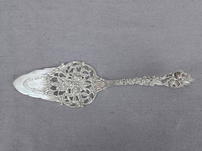 German 800 Silver Cake Pastry Dessert Server: Nice antique German 800 silver pastry server with repousse and pierced rose design. Marked 800, and crescent and moon mark used starting in 1886.Good condition.Measures approximately 2 1/8 inches wide