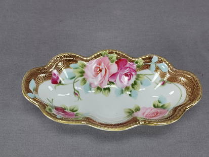 Nippon Hand Painted Pink Roses & Gold Relish Dish: Nice antique Japanese porcelain relish dish. Decorated with dark and light pink roses with blue and green leaves. Has a brown and gold border. With gold gilding and beading along the edge. Marked on t