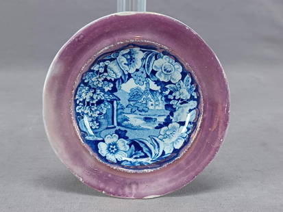 Antique Blue Transferware & Pink Luster Cup Plate: Nice antique early 19th century British pearlware cup plate. Decorated in a dark blue transfer pattern with a church surrounded by flowers and an urn. Pink luster border. Unmarked.Has a hairline